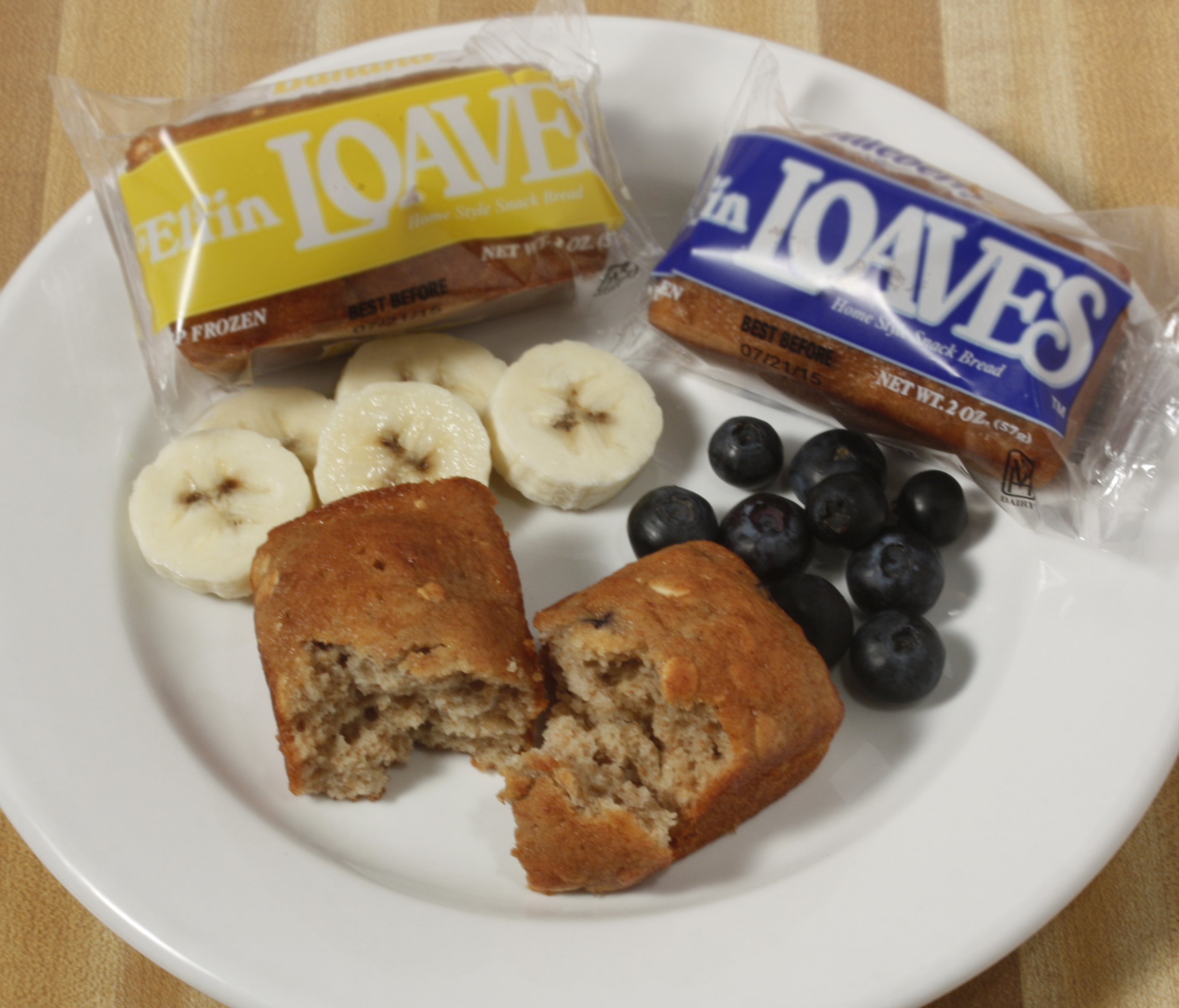 Plate of foodservice Whole Grain Banana and Blueberry Elfin Loaves in a school setting