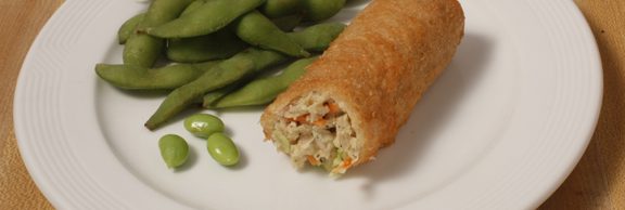 Plate of foodservice Golden Tiger Asian Vegetable Egg Roll with Snap Peas in a school setting